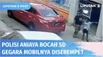 Terekam CCTV, seorang polisi menganiaya bocah SD berusia 10 tahun hanya karena mobilnya terserempet sepeda korban. Bocah malang tersebut dipukul dan ditendang hingga tersungkur.