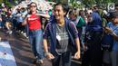 Peserta melakukan tarian Flashmob dalam kegiatan Pawai Tolak Plastik Sekali Pakai di Lapangan Aspirasi Monas, Jakarta, Minggu (21/7/2019). Pawai bebas plastik ini akan menjadi aksi terbesar di Indonesia untuk menolak penggunaan plastik sekali pakai. (Liputan6.com/Immanuel Antonius)