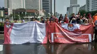 Mahasiswa menggelar aksi pilkada damai di acara car free day (Khairur Rasyid/Liputan6.com)