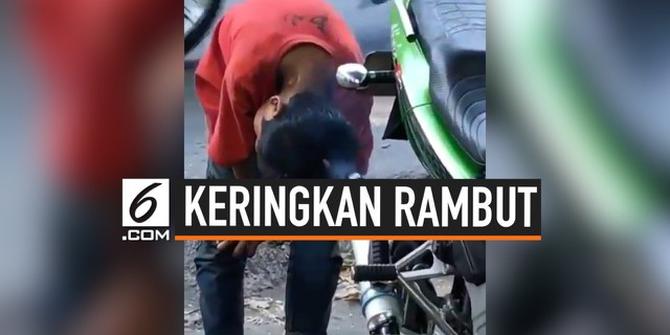 VIDEO: Aksi Bocah Keringkan Rambut Pakai Knalpot Bikin Gagal Paham
