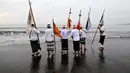 Upacara Melasti merupakan bagian penting dari budaya Bali yang melambangkan pemurnian dan persiapan jelang perayaan Nyepi. (Sonny TUMBELAKA/AFP)