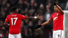 Pemain Manchester United Anthony Martial (kanan) merayakan golnya ke gawang Newcastle United pada pertandingan Liga Inggris di Old Trafford, Manchester, Inggris, Kamis (26/12/2019). Manchester United menang 4-1 atas Newcastle United. (Martin Rickett/PA via AP)