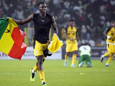 Pemain Ghana melakukan selebrasi pada akhir pertandingan leg kedua kualifikasi Piala Dunia 2022 melawan Nigeria di Stadion Moshood Abiola, Abuja, Nigeria, 29 Maret 2022. Ghana lolos ke Piala Dunia 2022 setelah unggul agregat gol tandang, skor akhir pertandingan ini 1-1. (AP Photo/Sunday Alamba)