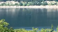 Seorang wanita yang sedang berlibur mengaku telah mengabadikan Loch Ness di tempat legenda monster itu berasal (Calley Tuleth/SWNS.com)