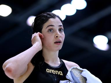 Yusra Mardini merupakan seorang atlet renang putri kategori 100 meter gaya bebas dan gaya kupu-kupu pada Olimpiade Tokyo 2020. Ia merupakan warga Suriah yang saat ini tinggal di Hamburg, Jerman dengan status pengungsi. (Foto: AFP/Ronny Hartmann)