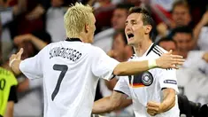 Miroslav Klose celebrates with Bastian Schweinsteiger after scoring the 2-1 during the Euro 2008 championships semi-final football match Germany vs Turkey on June 25, 2008 at St Jakob-Park stadium in Basel, Switzerland. AFP PHOTO DDP / TORSTEN SILZ
