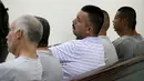 Salah satu dari enam orang terpidana terlihat serius mendengarkan putusan hakim di ruang sidang di Ciudad Juarez, Meksiko (27/7/2015). Pengadilan menjatuhkan vonis 679 tahun penjara kepada lima dari 6 orang tersebut. (REUTERS/Jose Luis Gonzalez)