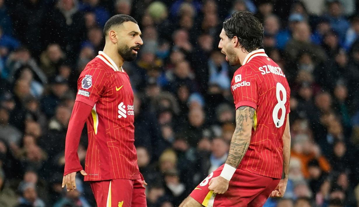 Mohamed Salah menjadi aktor kemenangan Liverpool saat bertandang ke markas Manchester City dalam lanjutan Liga Inggris 2024/2025 di Etihad Stadium, Minggu (23/2/2025) malam WIB. Winger asal Mesir itu mencetak satu gol dan satu assist. (AP Photo/Dave Thompson)