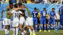 Selebrasi pemain Uruguay usai menumbangkan Italia 1-0 di laga penutup penyisihan Piala Dunia Grup D di Stadion das Dunas, Natal, Brasil, (24/6/2014). (REUTERS/Yves Herman)