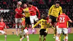 Gelandang PSV Eindhoven, Jerdy Schouten (kedua kiri) bersama Malik Tillman melompat untuk merebut bola dari pemain depan Dortmund Niclas Fuellkrug (tengah) saat pertandingan sepak bola leg pertama babak 16 besar Liga Champions melawan Borussia Dortmund di Stadion Philips, Eindhoven, 20 Februari 2024. (JOHN THYS/AFP)
