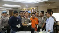Sudirman, pelaku penembakan Italia Chandra Kirana Putri saat digelandang di Mapolda Metro Jaya. (Liputan6.com/Nafisyul Qodar)