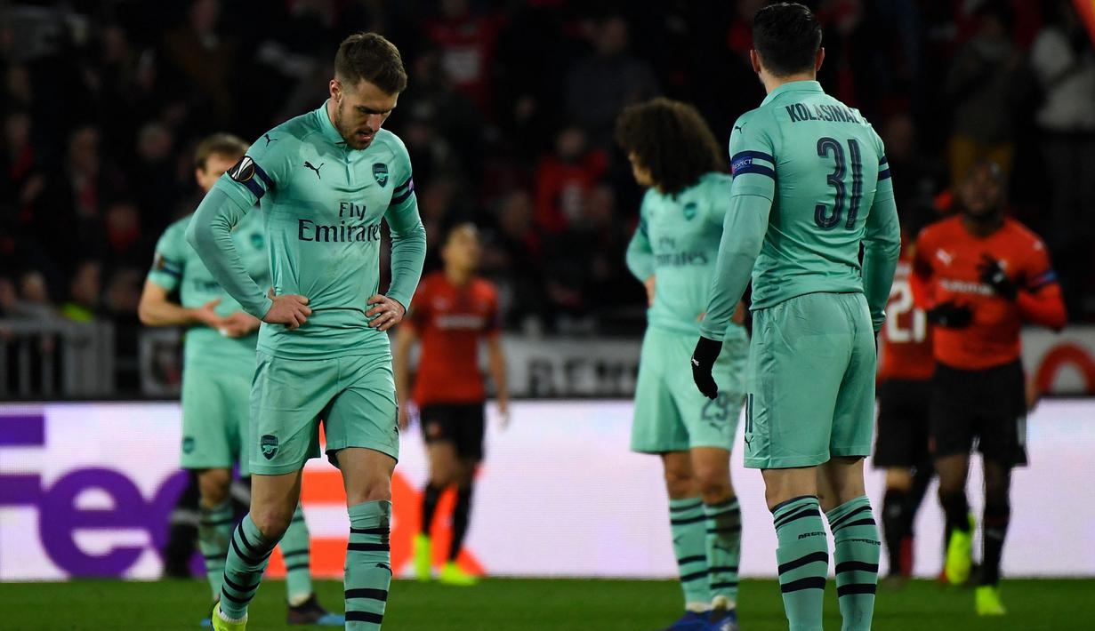 Leg pertama babak 16 besar kompetisi antar-klub Eropa kembali menjadi kuburan bagi Arsenal saat menghadapi klub asal Prancis. Kali ini giliran Stade Rennais yang mampu membungkam Arsenal dengan skor 3-1 pada leg pertama babak 16 besar Liga Europa musim 2018/2019 (7/3/2019). Tampil di hadapan publik sendiri, Arsenal sempat unggul terlebih dahulu lewat gol Alex Iwobi pada awal babak pertama, namun akhirnya Stade Rennais yang jadi pemenang dengan mencetak tiga gol via Benjamin Bourigeaud, gol bunuh diri Nacho Monreal dan ditutup oleh gol Ismaila Sarr. (AFP/Damien Meyer)