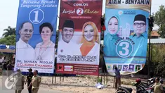 Tiga baliho calon Walikota dan Wakil Walikota Tangerang Selatan Tahun 2015 terpasang di Bundaran Maruga, Tangerang Selatan, (2/9/2015). (Liputan6.com/Helmi Afandi) 