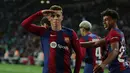 Empat gol Barca kali ini datang dari Fermin Lopez (22') dan hattrick Robert Lewandowski (49', 82', 90+3'). (LLUIS GENE / AFP)