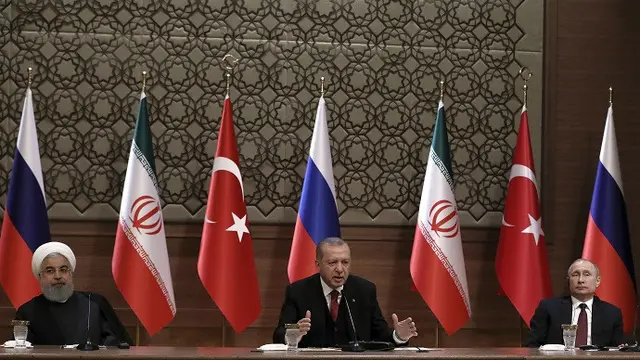 Presiden Iran Hassan Rouhani, Presiden Turki Recep Tayyip Erdogan, dan Presiden Vladimir Putin bertemu di Ankara untuk membahas isu Suriah