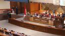 Suasana Rapat Paripurna ke-13 DPR RI beragendakan Pembicaraan Tingkat II/Pengambilan Keputusan atas RUU tentang Ibu Kota Negara di Kompleks Parlemen, Jakarta, Selasa (18/1/2022). DPR mengesahkan RUU Ibu Kota Negara (IKN) menjadi Undang-Undang. (Liputan6.com/Angga Yuniar)