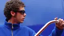 Pebalap Italia, Valentino Rossi dengan rambut ikal pendek. (AFP/Cristina Quicler)