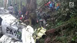 Pesawat Dimonim PK-HVQ yang sempat hilang kontak ditemukan di Kabupaten Pegunungan Bintang, Papua, Minggu (12/8). Pesawat pertama kali ditemukan oleh masyarakat. (Liputan6.com/HO/Humas Polda Papua)