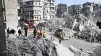 Kompleks bangunan apartemen sisa perang Suriah di Aleppo roboh, menyebabkan 11 orang tewas (AFP/George Ourfalian)