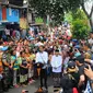 Pasangan Capres Cawapres Joko Widodo (Jokowi)-Ma'ruf Amin menyampaikan pidato kemenangannya di Kampung Deret, Tanah Tinggi, Jakarta, Selasa (21/5/2019). Pidato tersebut menanggapi keputusan KPU yang menetapkan pasangan Jokowi-Ma'ruf Amin sebagai pemenang Pilpres 2019. (Liputan6.com/Angga Yuniar)