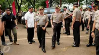 Kapolri Jenderal Tito Karnavian menghadiri peringatan Hari Kesatuan Gerak Bhayangkari ke 64 di Rusun Marunda, Jakarta, Kamis (29/9). Acara itu diisi dengan bakti sosial, seperti perpanjangan SIM, e-KTP dan akta kelahiran. (Liputan6.com/Gempur M Surya)