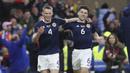 Pemain Skotlandia, Scott McTominay (kiri) melakukan selebrasi setelah mencetak gol kedua timnya ke gawang Spanyol pada matchday kedua Kualifikasi Euro 2024 di Hampden Park, Glasgow, Skotlandia, Rabu (29/03/2023) WIB. Skotlandia berhasil menang dengan skor 2-0. (AP Photo/Scott Heppell)