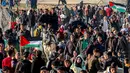 Melalui jalur pesisir, ribuan pengungsi Palestina bergerak menuju Gaza utara mulai pukul 7 pagi waktu setempat. (Omar AL-QATTAA/AFP)