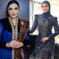 Ashanty tampil dengan kebaya biru navy panjang model velvet. Kebaya yang dibuat oleh Windy Savosa Couture ini memiliki bordiran di bagian depan. Melengkapi tampilannya dengan selendang batik senada dengan bawahan. Dan mengenakan bros di selendangnya. [@ashanty_ash].
