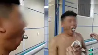 Ikuti tantangan nyeleneh, bohlam lampu malah nyangkut di mulut (Sumber: YouTube/1818黄金眼)