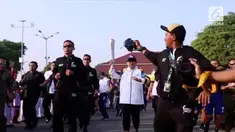 Menteri Luar Negeri, Retno Marsudi. menjadi pelari pertama yang membawa api obor Asian Games 2018 dalam acara Torch Relay di Yogyakarta, Kamis (19/7/2018).