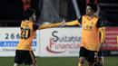 Gelandang Wolverhampton Wanderers, Vitinha (kiri) bersama rekan setim merayakan gol ke gawang Chorley dalam laga babak keempat Piala FA 2020/21 di Victory Park Stadium, Jumat (22/1/2021). Wolverhampton menang 1-0 atas Chorley. (AFP/Lindsey Parnaby)