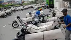 Pekerja mengemas motor sebelum dikirim menggunakan kereta di Stasiun Pasar Senen, Jakarta, Jumat (23/6). (Liputan6.com/Faizal Fanani)