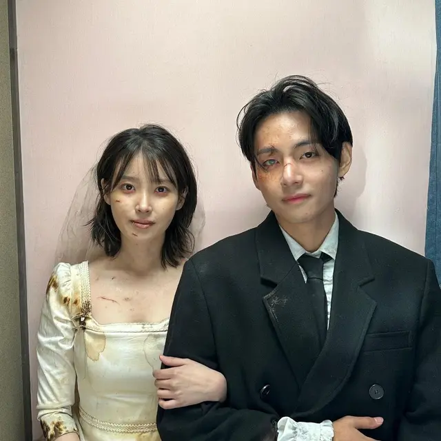 <p>IU dan V BTS di balik layar Love Wins All. (Instagram/ thv</p>