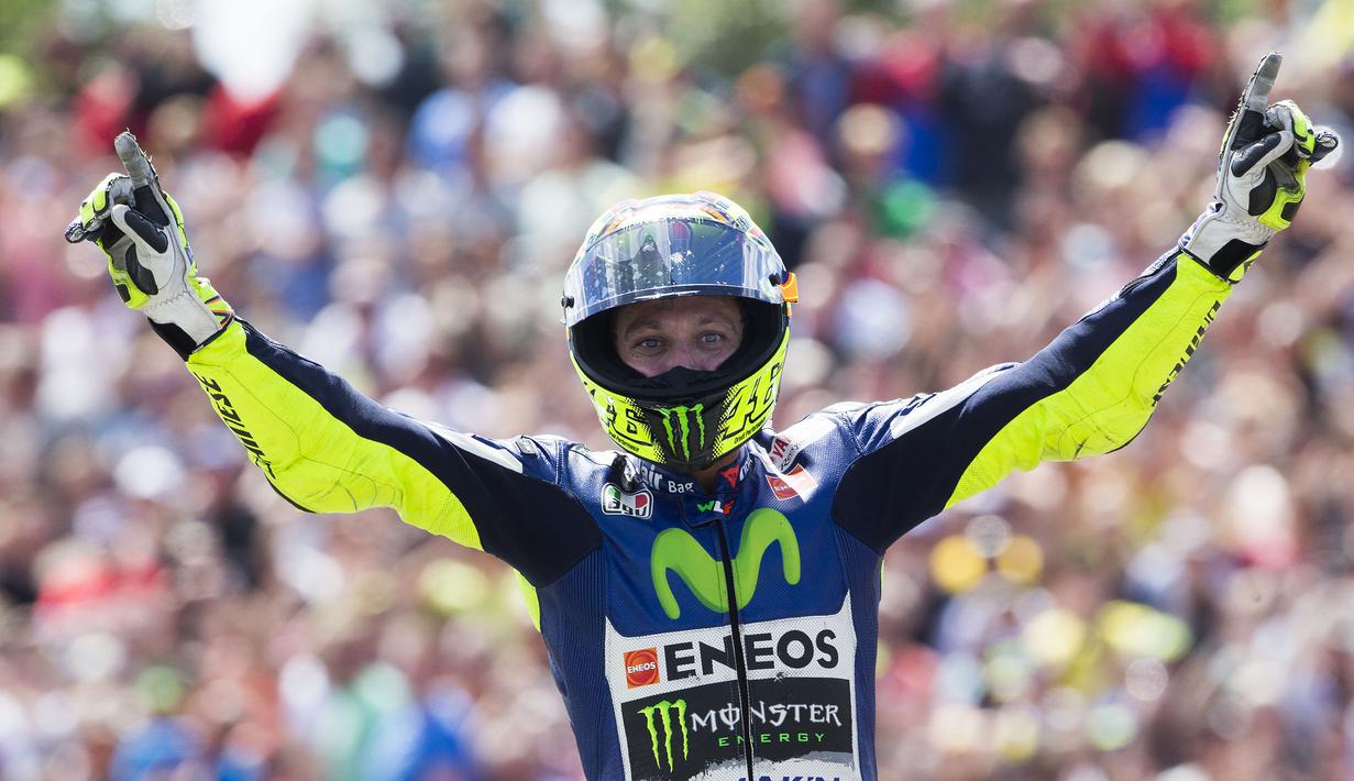 Ekspresi Valentino Rossi setelah menjadi juara. (AP Photo/Vincent Jannink)