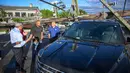 Badai besar menerjang sebagian besar wilayah timur Amerika Serikat pada Senin (7/8). Dua orang dilaporkan tewas, dan jutaan rumah serta bisnis kehilangan pasokan listriknya. (Jerry Jackson/The Baltimore Sun via AP)