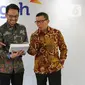 Direktur Utama PT Trimegah Sekuritas Indonesia Tbk Stephanus Turangan (tengah), Direktur David Agus dan Direktur Syafriandi Armand Saleh berfoto bersama usai acara RUPST Trimegah Sekuritas di Jakarta, Rabu (26/8/2020). (Liputan6.com/Fery Pradolo)