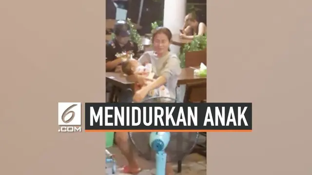 Beredar rekaman gambar yang memperlihatkan seorang wanita yang menidurkan anaknya sambil berjoget. Momen ini terjadi di salah satu restoran di Pratum Thani, Thailand.