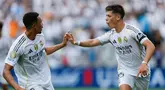 Pemain Real Madrid Arda Goman dan Trent Alexander-Arnold merespons setelah mencetak gol melawan Pachuca di Grup 2 Matchday H dari Piala Dunia 2025 di Stadion Bank of America pada hari Senin (06/23/2025) pagi. (AP Photo/Nell Redmond)
