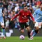 Gelandang Manchester United asal Uruguay #25, Manuel Ugarte (2 dari kiri), berlari ke arah bek Manchester City asal Portugal #03, Ruben Dias (kanan), sementara gelandang Manchester City asal Inggris #47, Phil Foden (kiri), dan gelandang Manchester City asal Belanda #04, Tijjani Reijnders (2 dari kanan), menyaksikan pertandingan&nbsp;Premier League&nbsp;antara Manchester City dan Manchester United di Stadion Etihad di Manchester, Inggris barat laut, pada 14 September 2025. (Oli SCARFF/AFP)
