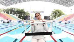 Jauh dari sorotan karier gemilangnya, Masniari memiliki tekad tinggi sejak kecil. Perenang berdarah Batak-Jerman ini memulai renang di usia 11 tahun di Wiesbaden, Jerman. Ia kemudian melanjutkan latihan hingga Frankfurt untuk mengasah kemampuan. (Dok. PB Akuatik Indonesia)