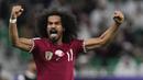 Pemain Qatar, Akram Afif melakukan selebrasi setelah mencetak gol kedua timnya pada laga semifinal Piala Asia 2023 di Al Thumama Stadium, Doha, Qatar, Rabu (07/02/2024). (AP Photo/Thanassis Stavrakis)