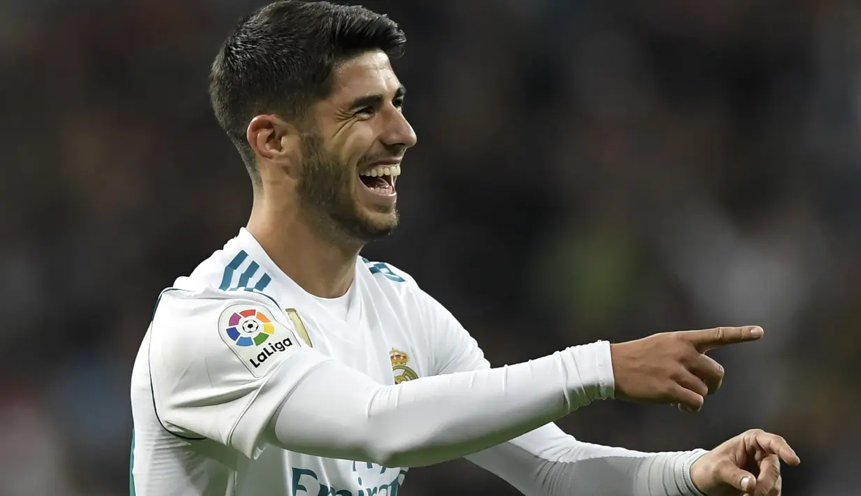 Gelandang Real Madrid, Marco Asensio masuk dalam daftar incaran Manchester United pada Januari 2018. Manurut Don Balon (media spanyol) Jose Maourinho siap memberikan tempat utama pada skuat Setan Maerah untuk Asensio. (AFP/Gabriel Bouys)