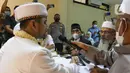 Suasana ijab kabul pernikahan anak narapidana terorisme (napiter) di Rumah Tahanan Polda Metro Jaya, Sabtu (14/5/2022). Dentasemen Khusus (Densus) 88 Polri bekerjasama dengan Satuan Perawatan Tahanan dan Barang Bukti (Sat Tahti) memfasilitasi pernikahan anak narapidana terorisme (napiter) Husein Hasny (Habib Husein). (Liputan6.com/Herman Zakharia)