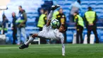 Anak Cristiano Ronaldo, Cristiano Ronaldo Jr melakukan tendangan salto usai pertandingan antara Real Madrid dan Atletico Madrid di stadion Santiago Bernabeu, Madrid (8/4). Anak Ronaldo melakukan tendangan salto meniru sang ayah. (AFP Photo/Gabriel Bouys)