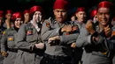 Personel Kepolisian Republik Indonesia (Polri) mengambil bagian dalam upacara memperingati Hari Bhayangkara ke-79 di Banda Aceh pada Selasa 1 Juli 2025. (CHAIDEER MAHYUDDIN/AFP)