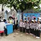 Aksi Polantas cilik mewarnai Operasi Zebra 2018 yang digelar di kawasan Lhoksukon, Aceh. (Liputan6.com/ Rino Abonita)