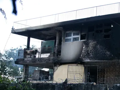 Dinding yang menghitam setelah kebakaran melanda Panti Asuhan Church of Bible Understanding di pinggiran Port-au-Prince di ibu kota Haiti, Jumat (14/2/2020). Dua anak tewas di lokasi, sementara 13 lainnya setelah sempat dirawat di rumah sakit. (AP/Dieu Nalio Chery)