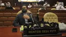 Mendes PDTT Abdul Halim Iskandar bersiap mengikuti rapat kerja dengan Komisi V DPR di Senayan, Jakarta, Senin (11/4/2022). Rapat membahas isu-isu terkait desa tertinggal serta rekruitmen Tenaga Pendamping Desa. (Liputan6.com/Angga Yuniar)