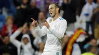 Striker Real Madrid, Gareth Bale, melakukan selebrasi usai mencetak gol ke gawang Celta Vigo pada laga La Liga di Stadion Santiago Bernabeu, Sabtu (12/5/2018). Real Madrid menang 6-0 atas Celta Vigo. (AP/Paul White)