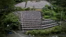 Penampakan patung Jizo yang didedikasikan untuk jiwa anak-anak yang telah meninggal dunia di Kuil Buddha Jizoji, Oganomachi, Prefektur Saitama, Jepang, Senin (13/8). (Behrouz Mehri/AFP)